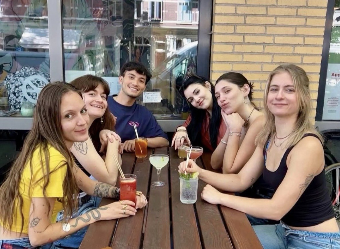 Students with cocktails on the Krater terrace